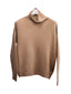Beige Merino turtleneck jumper on a white background
