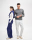 Male and female models wearing melange grey merino-cashmere blend jumper and blue merino trousers, full view.
