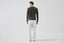 Man wearing a dark green jumper, back view 