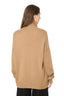 Model wearing a Beige Merino Wool Blend Turtleneck Jumper, back view