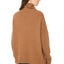 Model wearing a Camel Merino Angora Turtleneck Jumper, back view