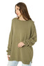 Model wearing Olive Green Oversized Merino Wool Jumper, side view 