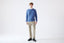 Model wearing blue merino-cashmere blend crew neck jumper, front view.
