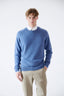 Model wearing blue merino-cashmere blend crew neck jumper, front view.