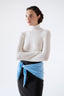 Model wearing blue merino wool triangle scarf with lace trim by Roksolana.