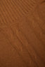 Close-up of ribbed turtleneck and cable knit detail on brown merino-cashmere blend jumper.