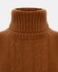 Close-up of ribbed turtleneck and cable knit detail on brown merino-cashmere blend jumper.
