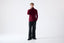 Model wearing burgundy merino wool turtleneck jumper, full-body front view.