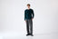 Model wearing deep green merino-cashmere blend crew neck jumper, front view.