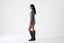 Model wearing a gray jumper and matching shorts on a white background