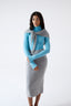 Model wearing a grey skirt on a white background