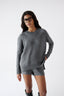 Model wearing grey merino wool-blend knitted shorts with matching jumper, front view.