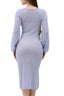 Model wearing a Lavender V-neck knit dress made from a merino-mohair blend, back view
