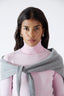 Close-up of model wearing light grey merino wool-angora triangle scarf by Roksolana.