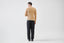 Model wearing beige merino wool jumper, back view