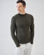 Man wearing a dark green merino sweater