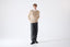 Model wearing beige merino wool crew neck jumper with white shirt by Roksolana.