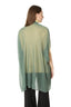Model wearing a Green Wool Poncho, back view 