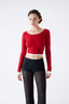 Roksolana knitwear – red cropped merino jumper styled with black mohair trousers