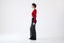 Roksolana knitwear – red cropped merino jumper styled with black mohair trousers, side view 