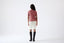 Model wearing a white skirt on a white background
