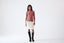 Model wearing a white skirt on a white background