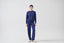 Model wearing cobalt blue merino wool-blend crew neck jumper with matching trousers, front view.