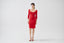 Full-length front view of model wearing red merino wool knitted pencil skirt with matching cardigan by Roksolana.