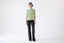 Model wearing a light green wool short-sleeve turtleneck jumper by Roksolana.